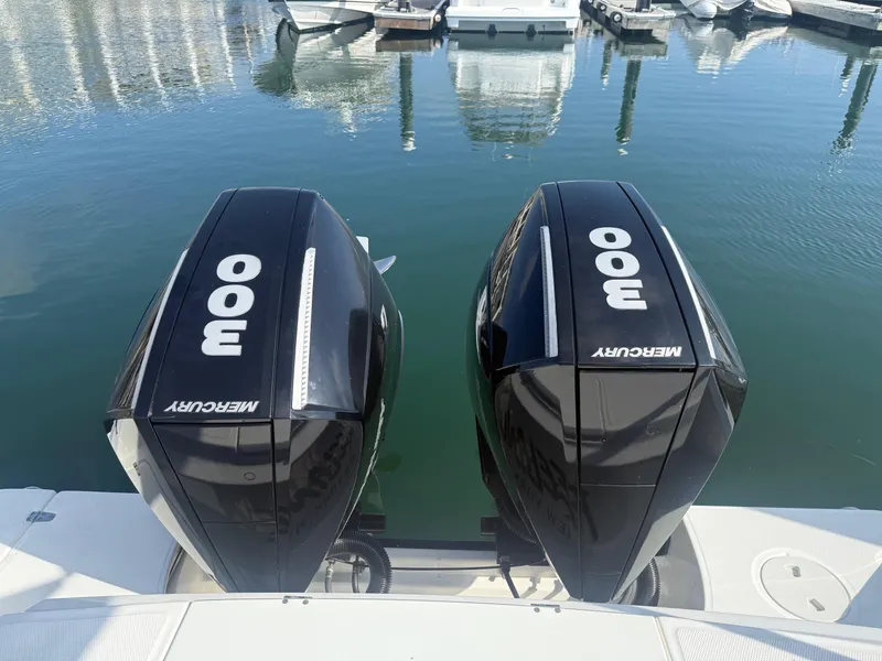 Slide: The Image of Twin Mercury 300 outboard engines on a 2021 Boston Whaler 330 Outrage boat. - 9