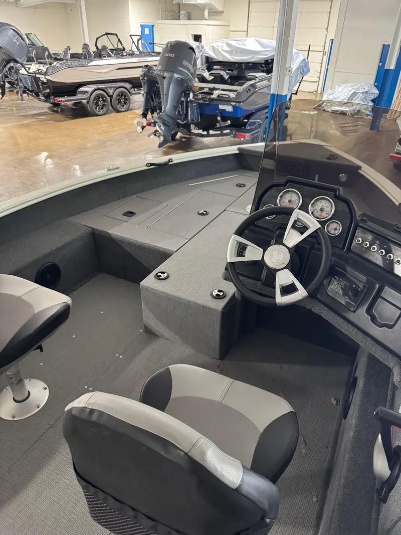 Slide: The Image of Interior of a 2024 G3 AV17C Vinyl boat with steering wheel and seating. - 11