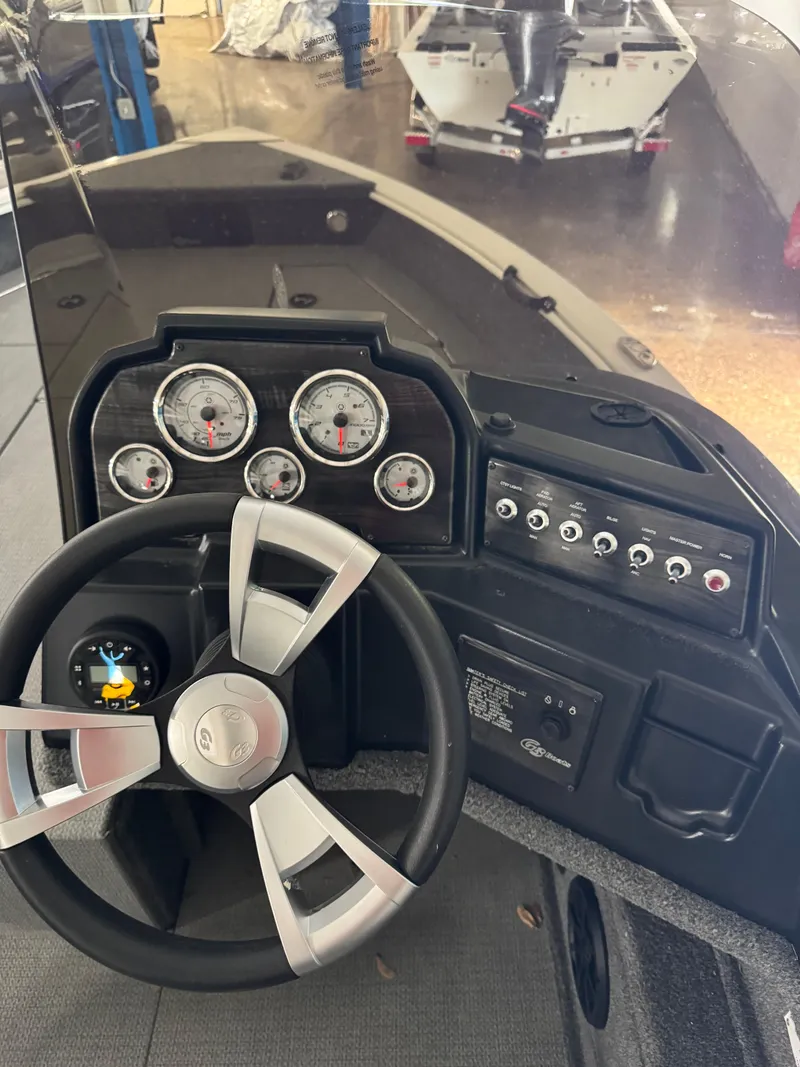 Slide: The Image of Steering console of 2024 G3 AV17C Vinyl boat with gauges and controls. - 12