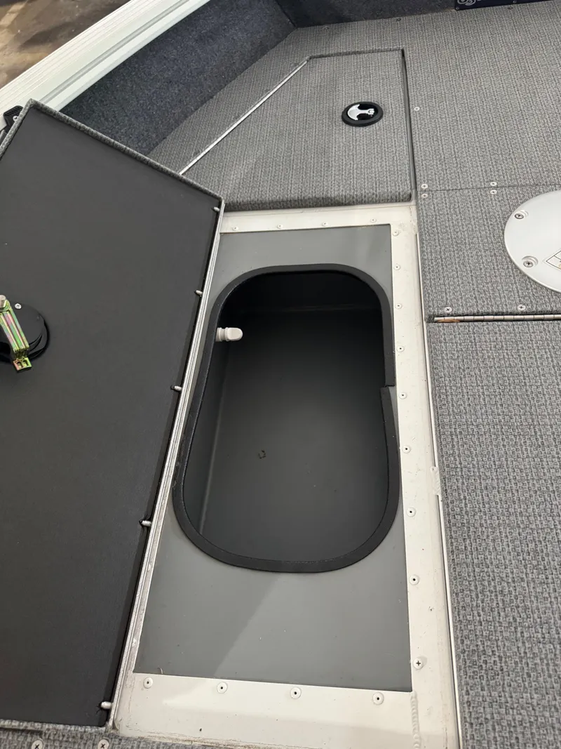 Slide: The Image of Open storage compartment on 2024 G3 AV17C Vinyl boat deck. - 15