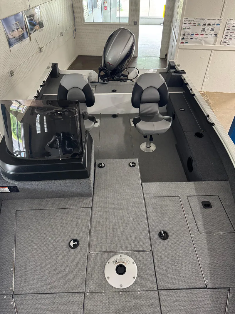 Slide: The Image of 2024 G3 AV17C Vinyl boat interior with dual seats and motor, showroom display. - 19