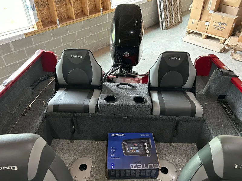 Slide: The Image of 2023 Lund 1650 Rebel XL Sport boat interior with seats and Lowrance Elite FS box. - 3