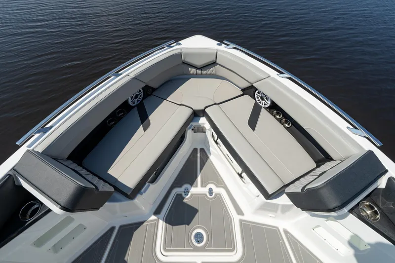 Slide: The Image of 2026 Monterey Elite 30 OB boat interior with luxurious seating and sleek design on calm water. - 7