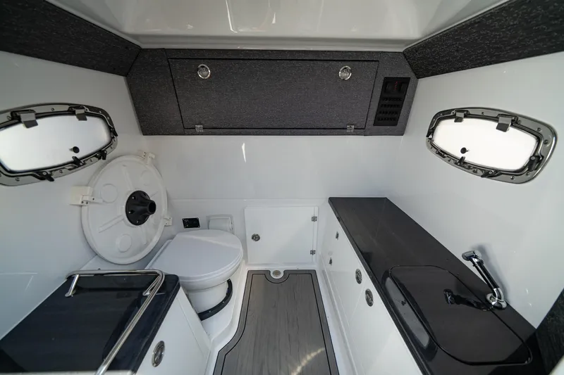 Slide: The Image of Luxurious bathroom interior of 2026 Monterey Elite 30 OB boat with modern fixtures. - 9