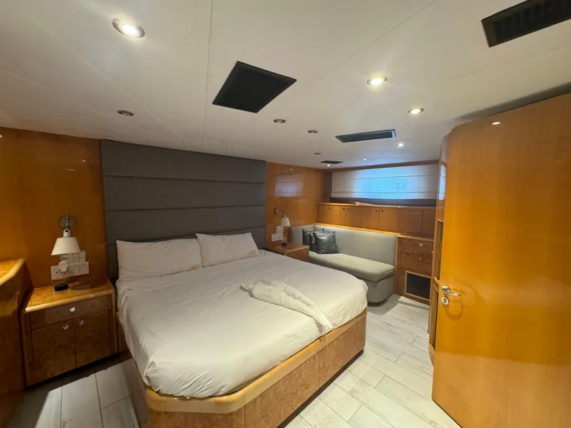 Slide: The Image of Luxurious bedroom interior of 2000 Baglietto 116 yacht with modern furnishings. - 12