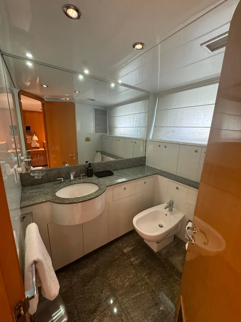 Slide: The Image of Luxurious bathroom on 2000 Baglietto 116 yacht with modern fixtures and elegant design. - 13