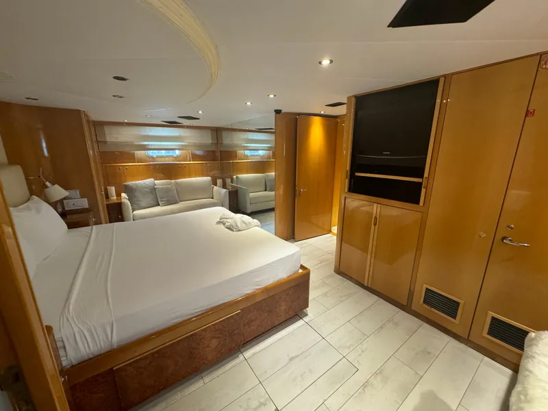 Slide: The Image of Luxurious bedroom interior of 2000 Baglietto 116 yacht with modern furnishings. - 17