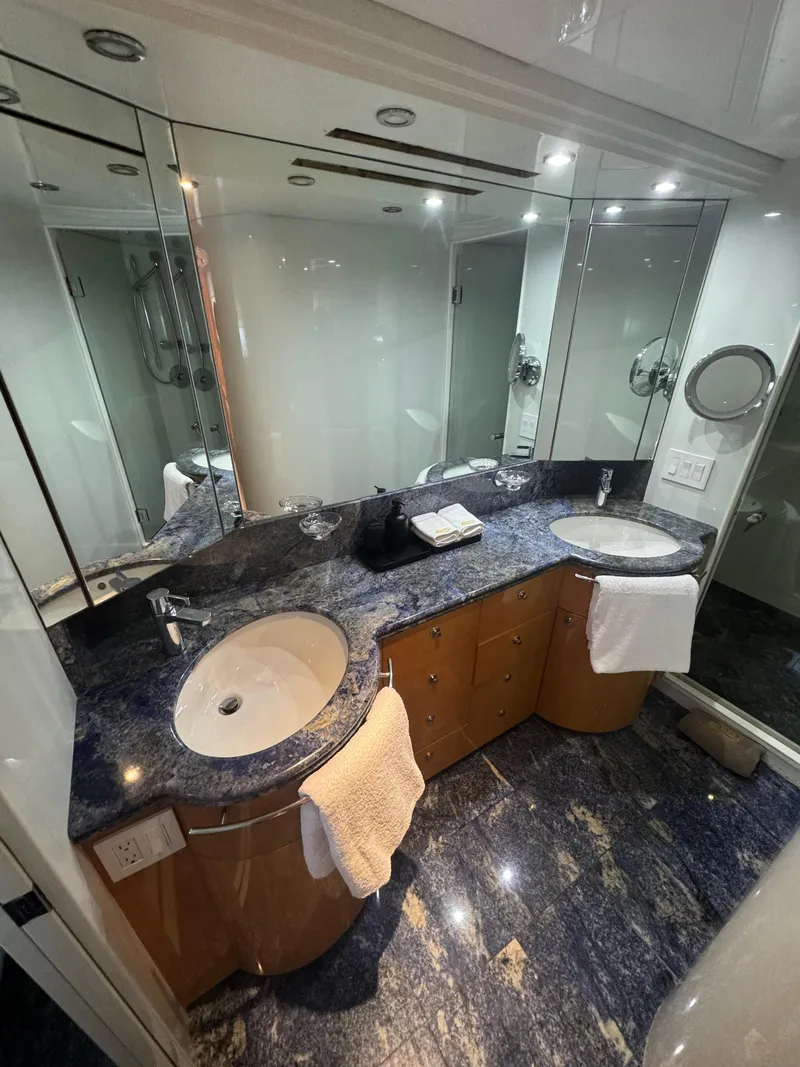 Slide: The Image of Luxurious bathroom on 2000 Baglietto 116 yacht with dual sinks and elegant marble countertops. - 18