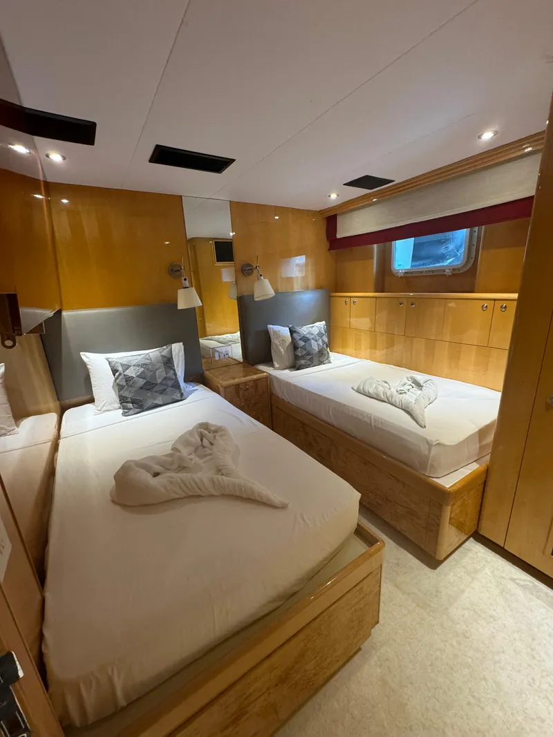 Slide: The Image of Luxurious twin cabin on 2000 Baglietto 116 yacht with modern wood finishes. - 19