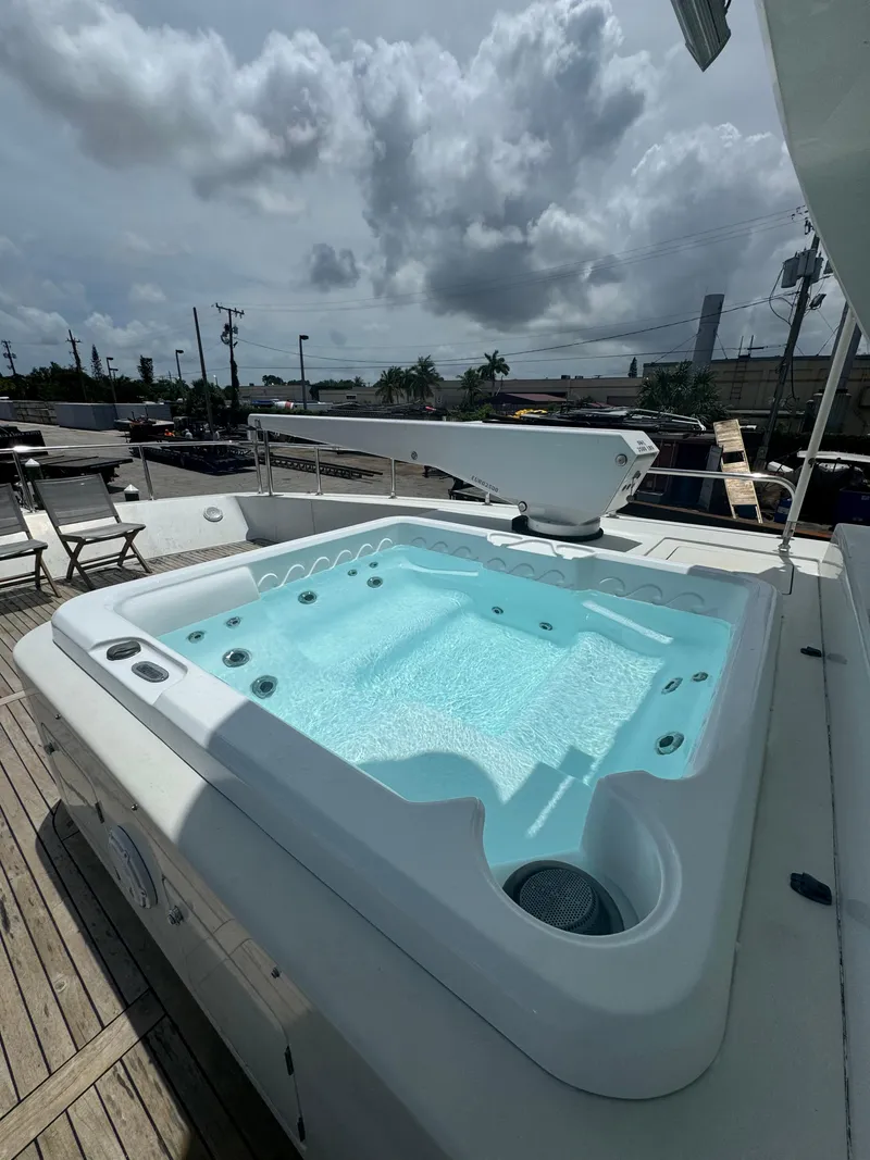 Slide: The Image of Jacuzzi on 2000 Baglietto 116 yacht deck under cloudy sky. - 23