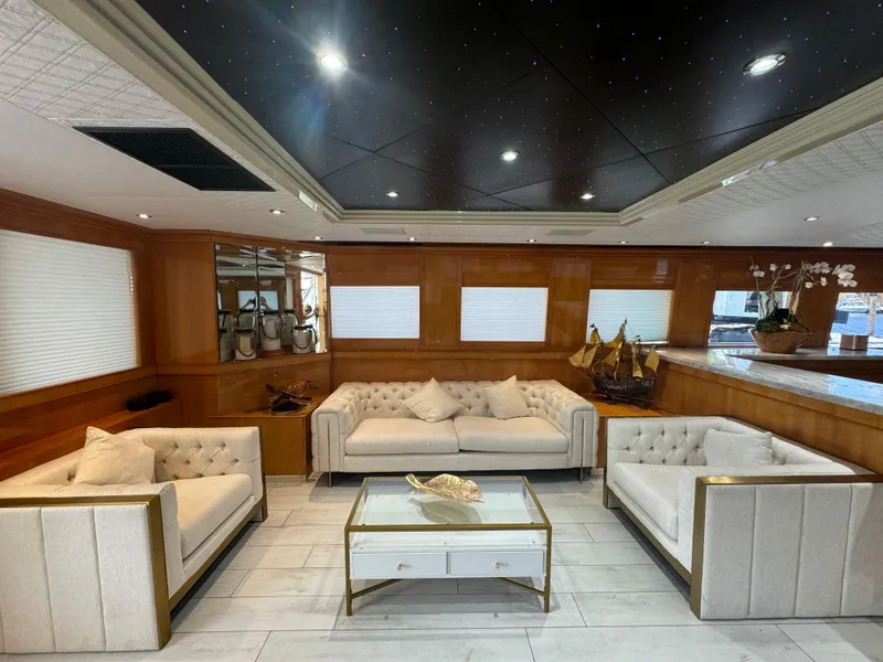 Slide: The Image of Luxurious interior of 2000 Baglietto 116 yacht with elegant seating and decor. - 3