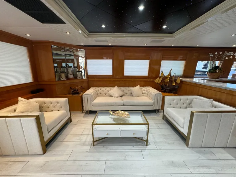 Slide: The Image of Luxurious yacht interior with elegant seating, glass table, and nautical decor on Baglietto 116, 2000 model. - 4