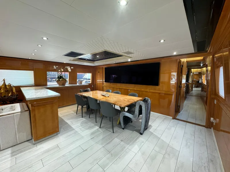 Slide: The Image of Luxurious interior of 2000 Baglietto 116 yacht with elegant dining area and modern decor. - 6