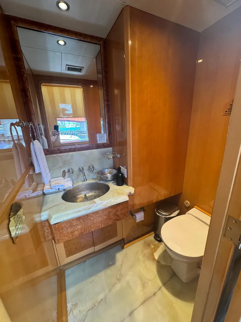 Slide: The Image of Luxurious bathroom on 2000 Baglietto 116 yacht with wood accents and modern fixtures. - 9