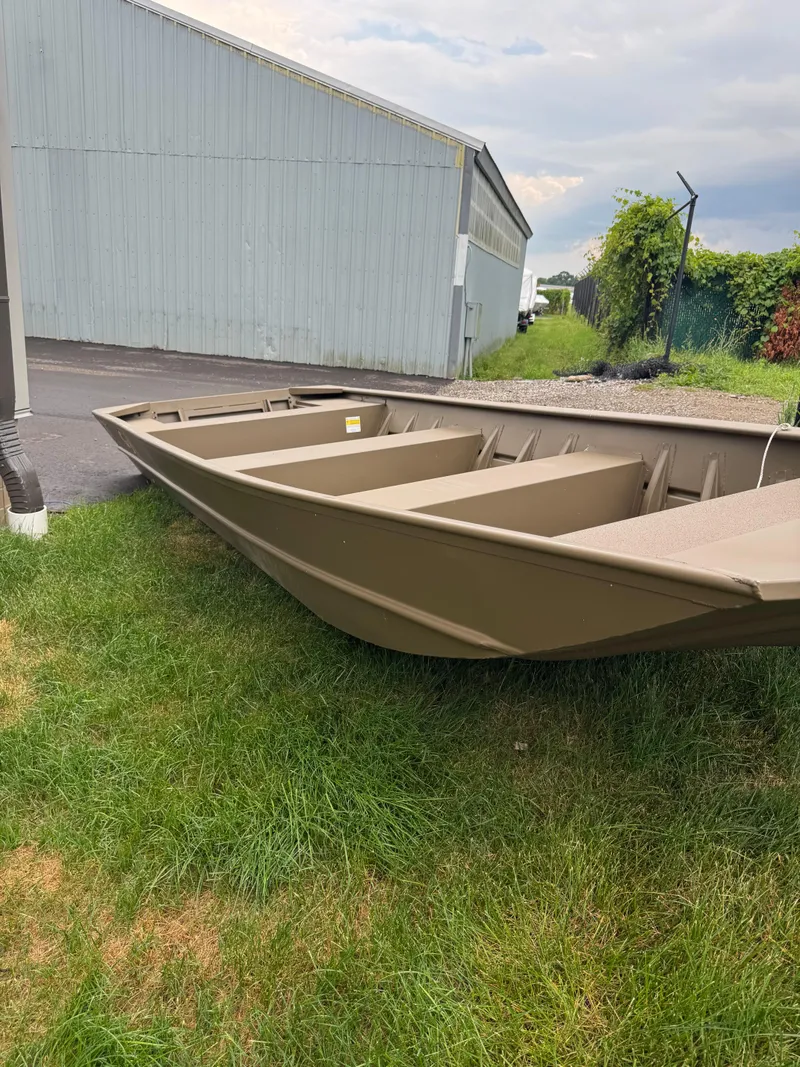 Slide: The Image of 2025 G3 1852 WSOF boat on grass near industrial building. - 4