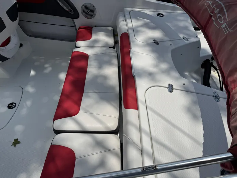Slide: The Image of Interior of a 2020 Tahoe 550TS boat with red and white seating. - 4