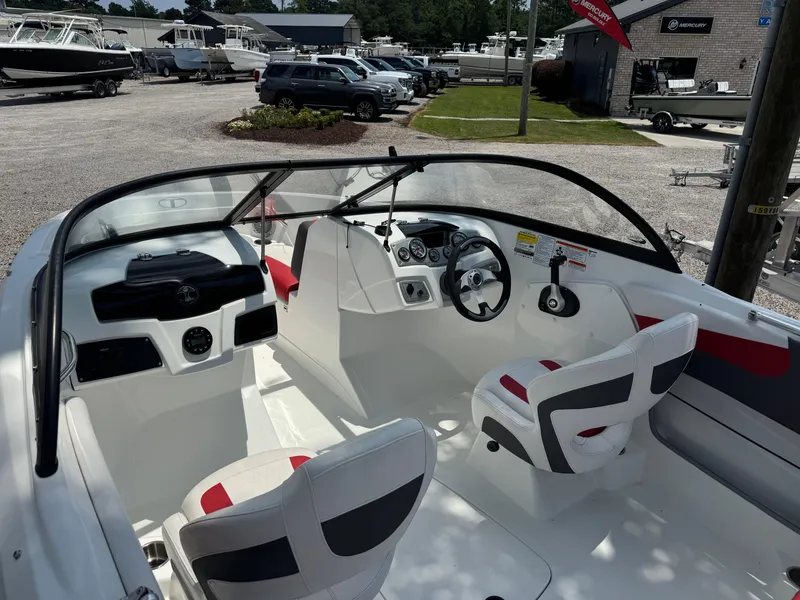Slide: The Image of Interior of a 2020 Tahoe 550TS boat with white and red seating. - 5