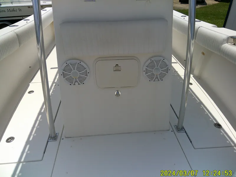 Slide: The Image of 2006 McKee Craft FREEDOM TE 28 boat deck with speakers and storage compartment. - 25