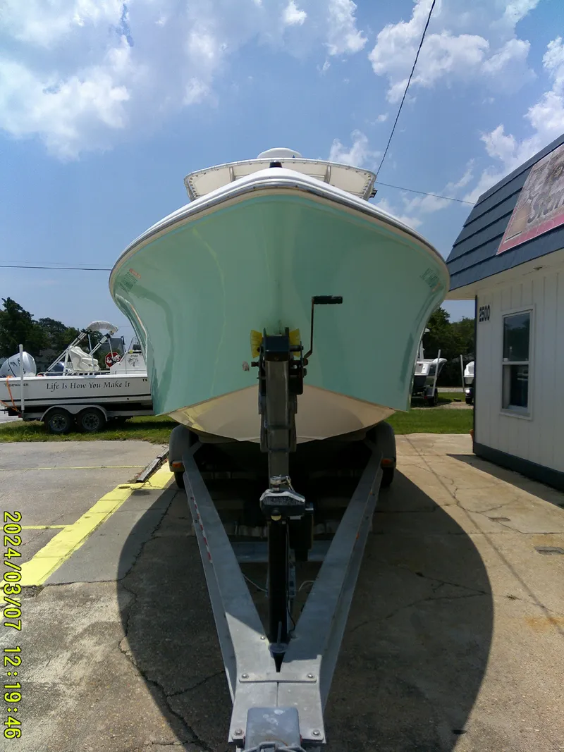 Slide: The Image of 2006 McKee Craft FREEDOM TE 28 boat on trailer under a sunny sky. - 3