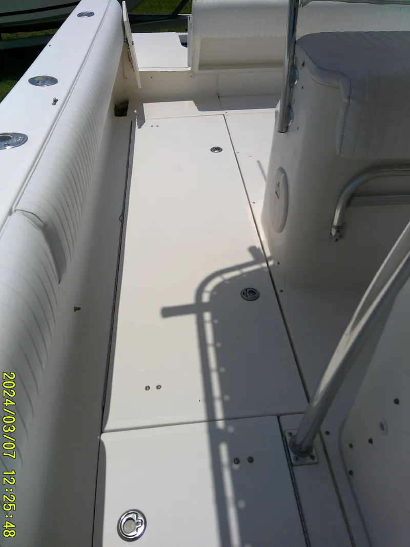 Slide: The Image of 2006 McKee Craft FREEDOM TE 28 boat interior with seating and deck view. - 33