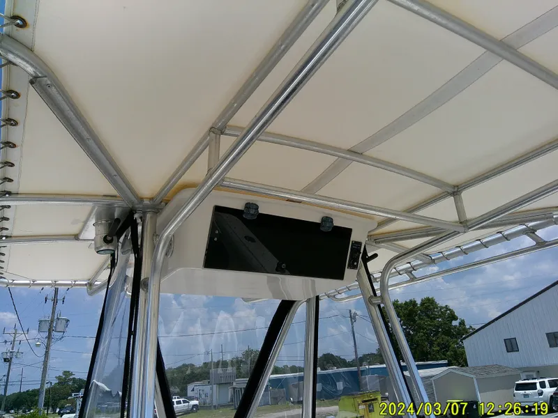 Slide: The Image of 2006 McKee Craft FREEDOM TE 28 boat canopy and frame, outdoor setting. - 40
