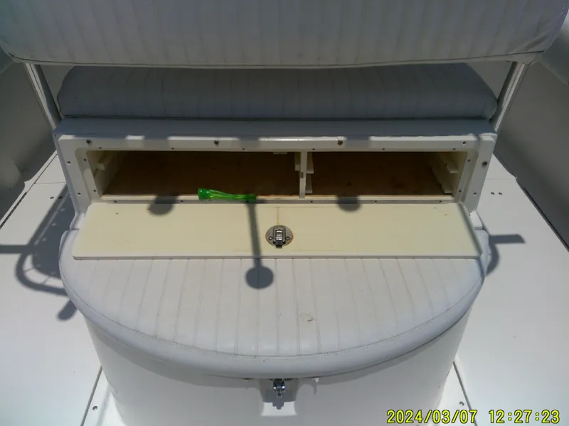 Slide: The Image of 2006 McKee Craft FREEDOM TE 28 boat storage compartment with open hatch. - 49