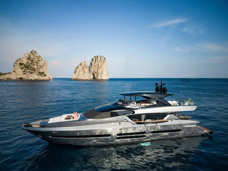 The Image of 2024 Posillipo Technema 90 luxury yacht cruising near rocky islands. - 0