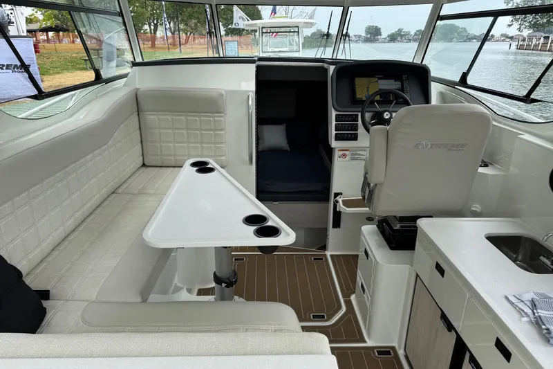 Slide: The Image of Interior of 2025 Extreme Boats 986 Game King, featuring helm and seating area. - 12