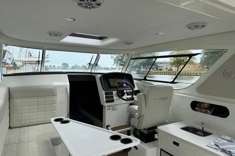 Slide: The Image of Interior of 2025 Extreme Boats 986 Game King with sink and storage cabinets. - 14