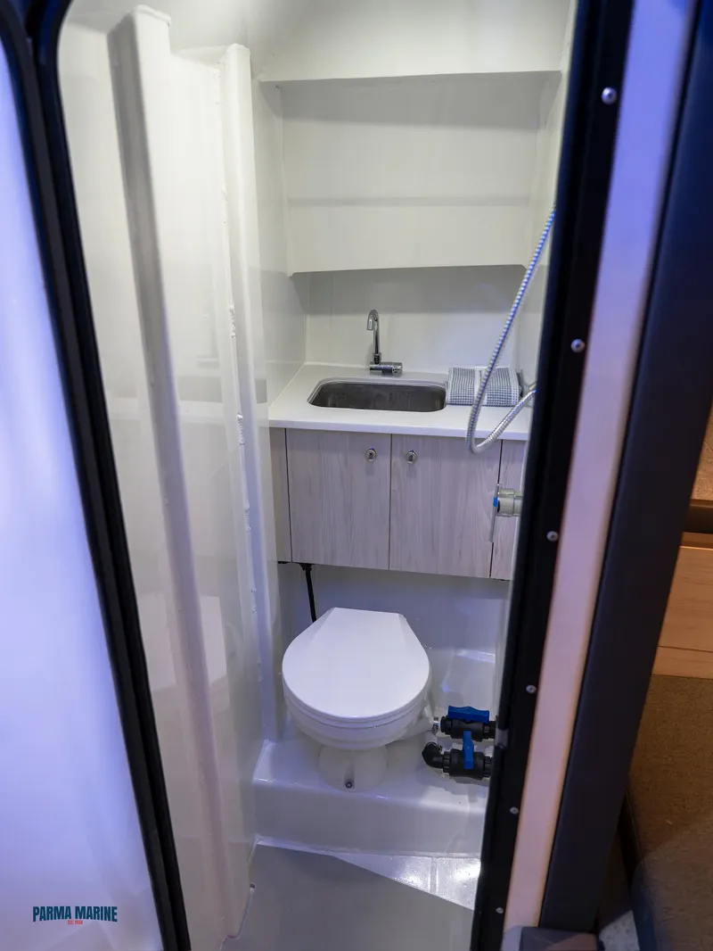 Slide: The Image of Interior of 2025 Extreme Boats 986 Game King with cushioned seating and table. - 17