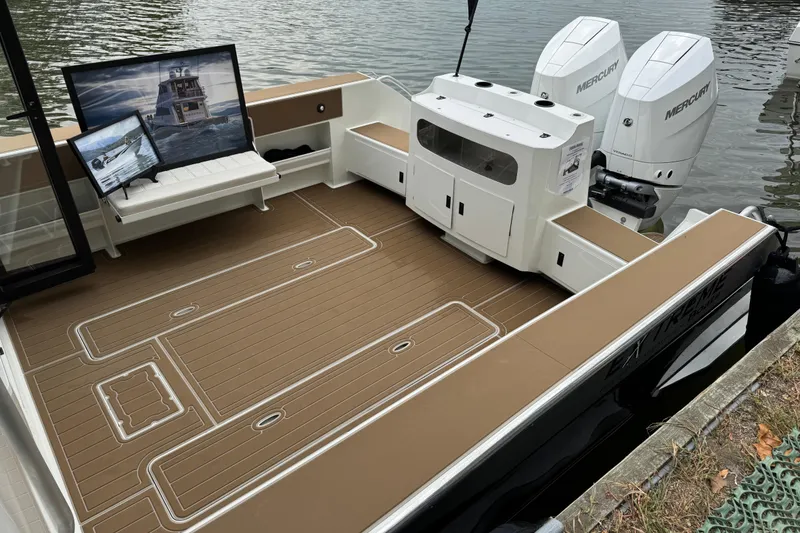 Slide: The Image of 2025 Extreme Boats 986 Game King with spacious deck and dual Mercury engines. - 5