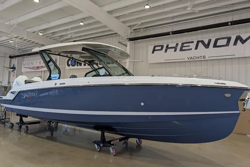 The Image of 2026 Monterey Elite 30 OB yacht displayed indoors at Phenom Yachts showroom. - 0