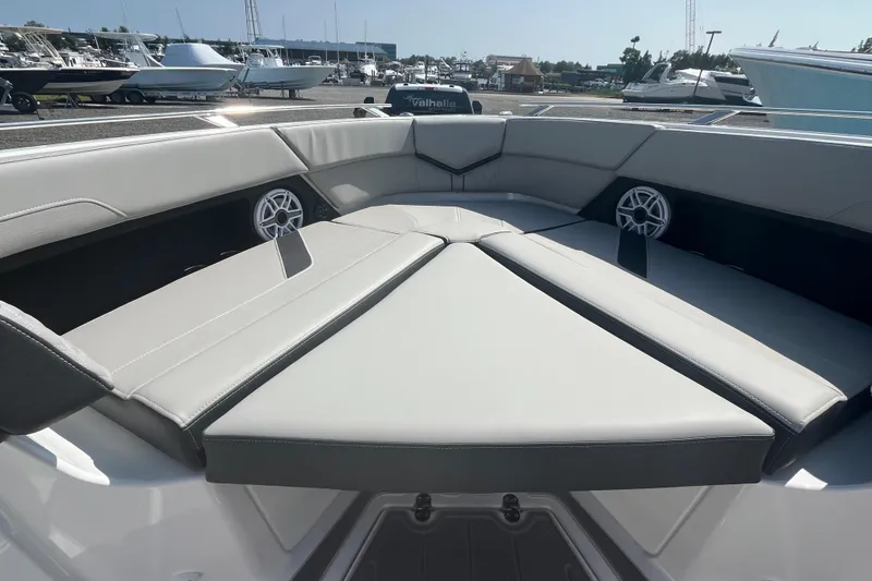 Slide: The Image of Luxury seating on 2026 Monterey Elite 30 OB boat, featuring elegant gray upholstery. - 10