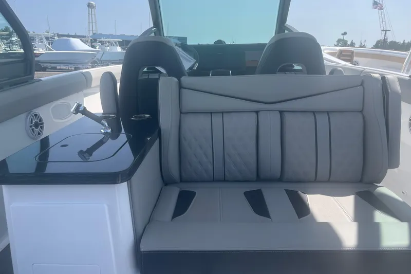 Slide: The Image of Luxurious seating in 2026 Monterey Elite 30 OB boat cockpit. - 9