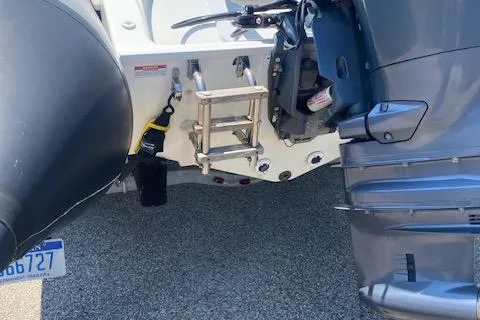 Slide: The Image of Rear view of a 2011 Zodiac Pro Open 650 boat with motor and ladder. - 10