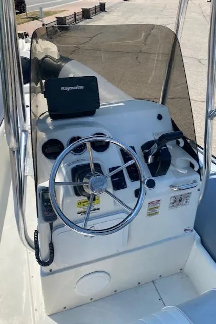 Slide: The Image of 2011 Zodiac Pro Open 650 boat console with steering wheel and navigation equipment. - 6