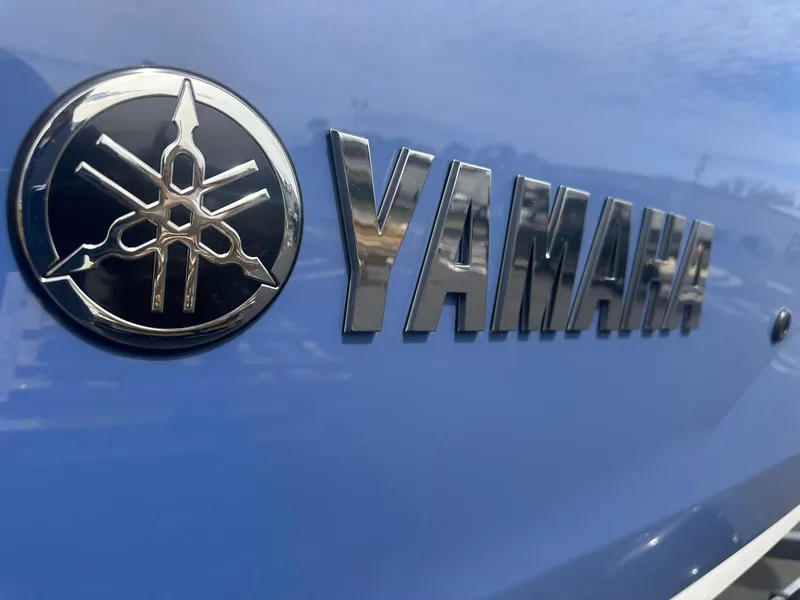 Slide: The Image of Close-up of Yamaha logo on 2025 AR220 boat, featuring sleek metallic design. - 3