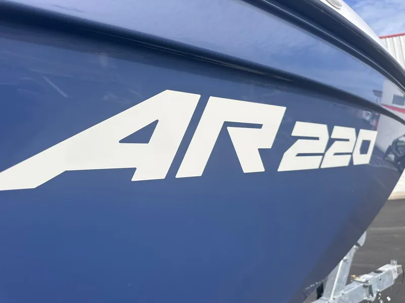 Slide: The Image of 2025 Yamaha Boats AR220, blue hull with bold white lettering. - 4