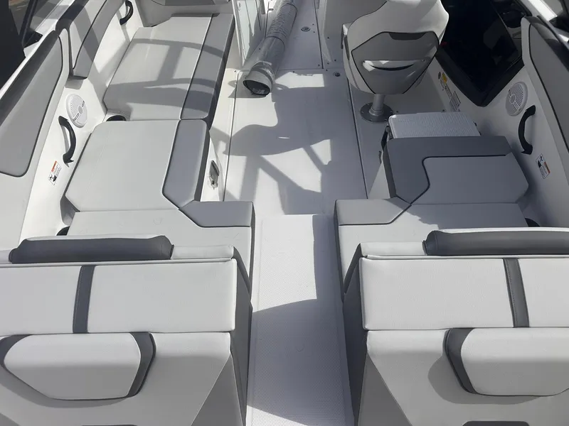 Slide: The Image of 2025 Yamaha Boats AR220 interior with gray seating and modern design. - 7