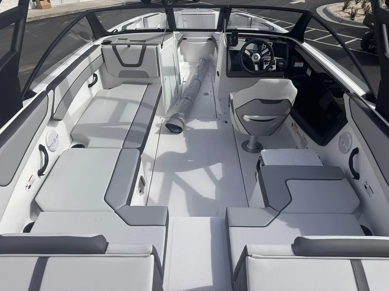 Slide: The Image of 2025 Yamaha Boats AR220 interior with sleek seating and modern dashboard design. - 8