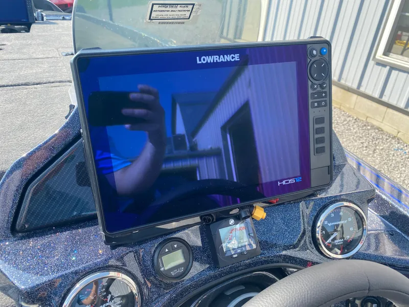 Slide: The Image of Dashboard of a 2026 Phoenix 921 2 Elite X with Lowrance HDS12 display. - 10