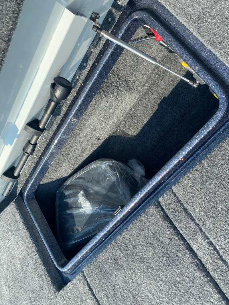 Slide: The Image of Storage compartment of 2026 Phoenix 921 2 Elite X boat, showing interior details. - 20