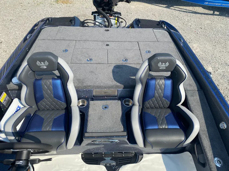 Slide: The Image of 2026 Phoenix 921 2 Elite X boat interior with dual blue and gray seats. - 23