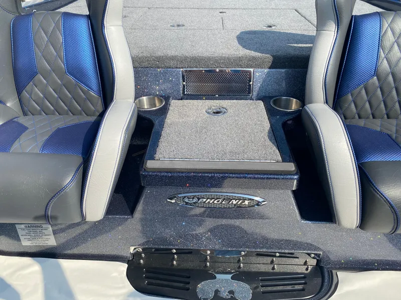 Slide: The Image of 2026 Phoenix 921 2 Elite X boat interior with blue and gray seats, center console. - 25