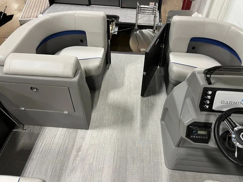 Slide: The Image of Interior of 2025 Qwest 8516 Lanai boat with modern seating and Garmin dashboard. - 6