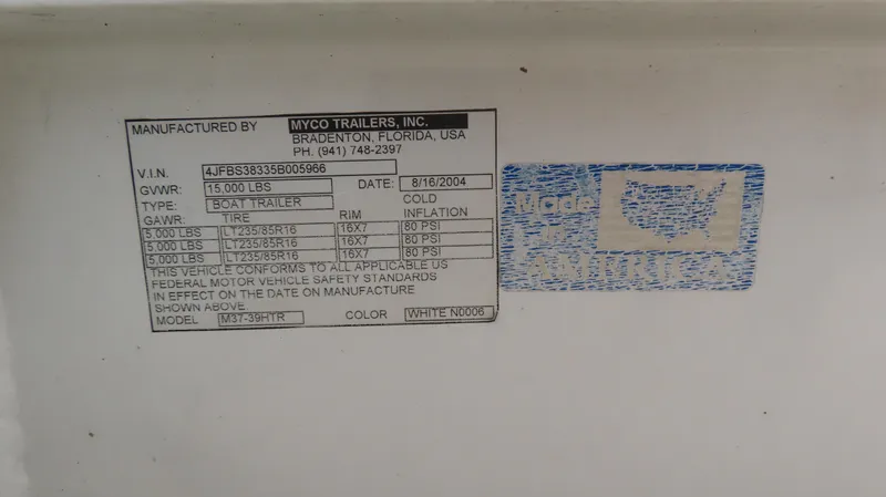 Slide: The Image of Boat trailer label by Myco Trailers, Inc., with 'Made in America' sticker. - 12