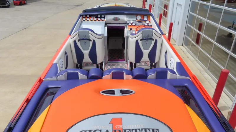Slide: The Image of 2005 Cigarette 38 Top Gun boat interior with vibrant seating and dashboard design. - 18