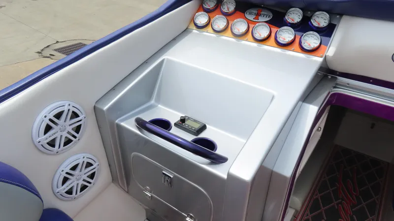 Slide: The Image of 2005 Cigarette 38 Top Gun boat dashboard with gauges and speakers. - 20