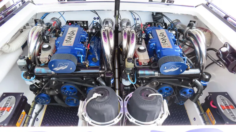 Slide: The Image of 2005 Cigarette 38 Top Gun boat engine compartment with dual Mercury 525 EFI engines. - 6