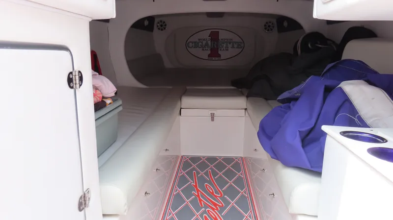 Slide: The Image of 2005 Cigarette 38 Top Gun boat interior with seating and storage. - 8